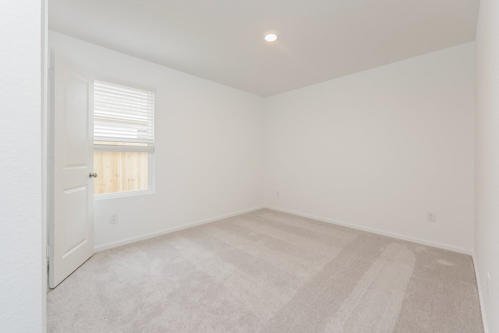 1527 Sunset Ridge Drive Conroe, TX 77306 - Photo 14 of 16 an empty room with windows