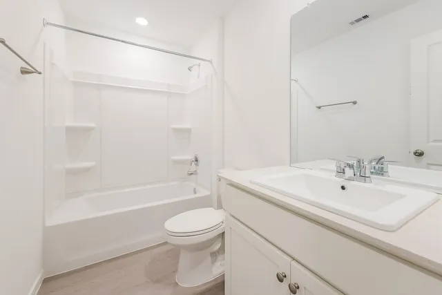 a bathroom with a sink a toilet and a bathtub