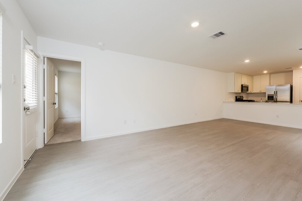 1527 Sunset Ridge Drive Conroe, TX 77306 - Photo 5 of 16 a view of a kitchen with a sink and cabinets