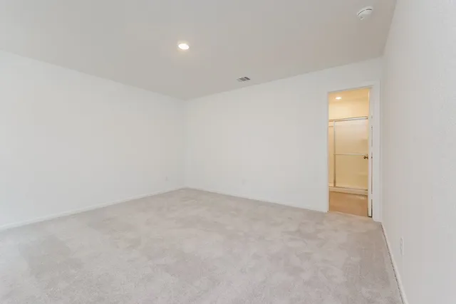 an empty room with a bathroom