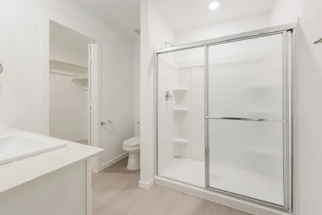 a bathroom with a glass shower door