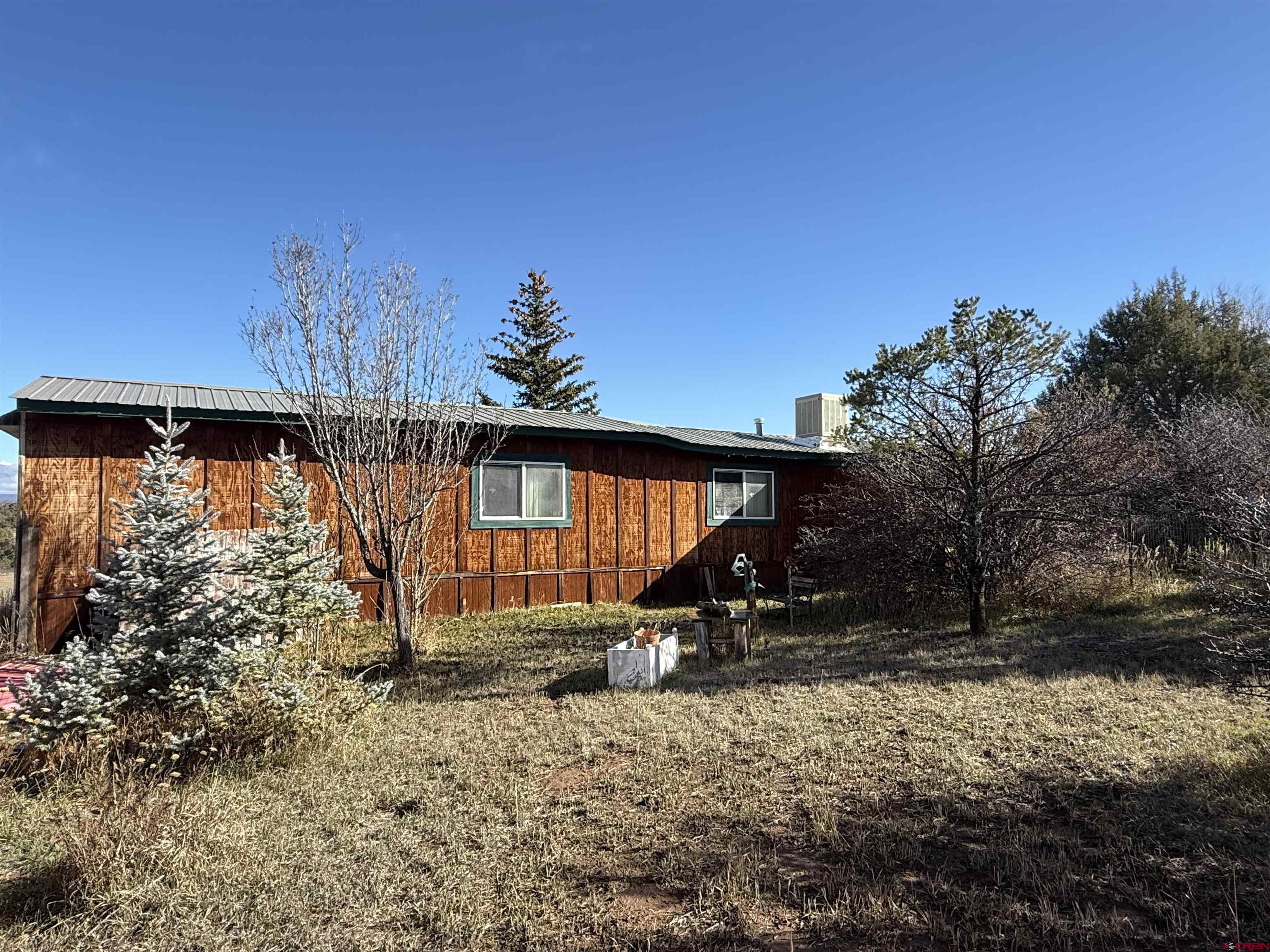 35575 Rd H.5 Mancos, CO 81328 - Photo 7 of 12 a backyard of a house with barbeque oven table and chairs