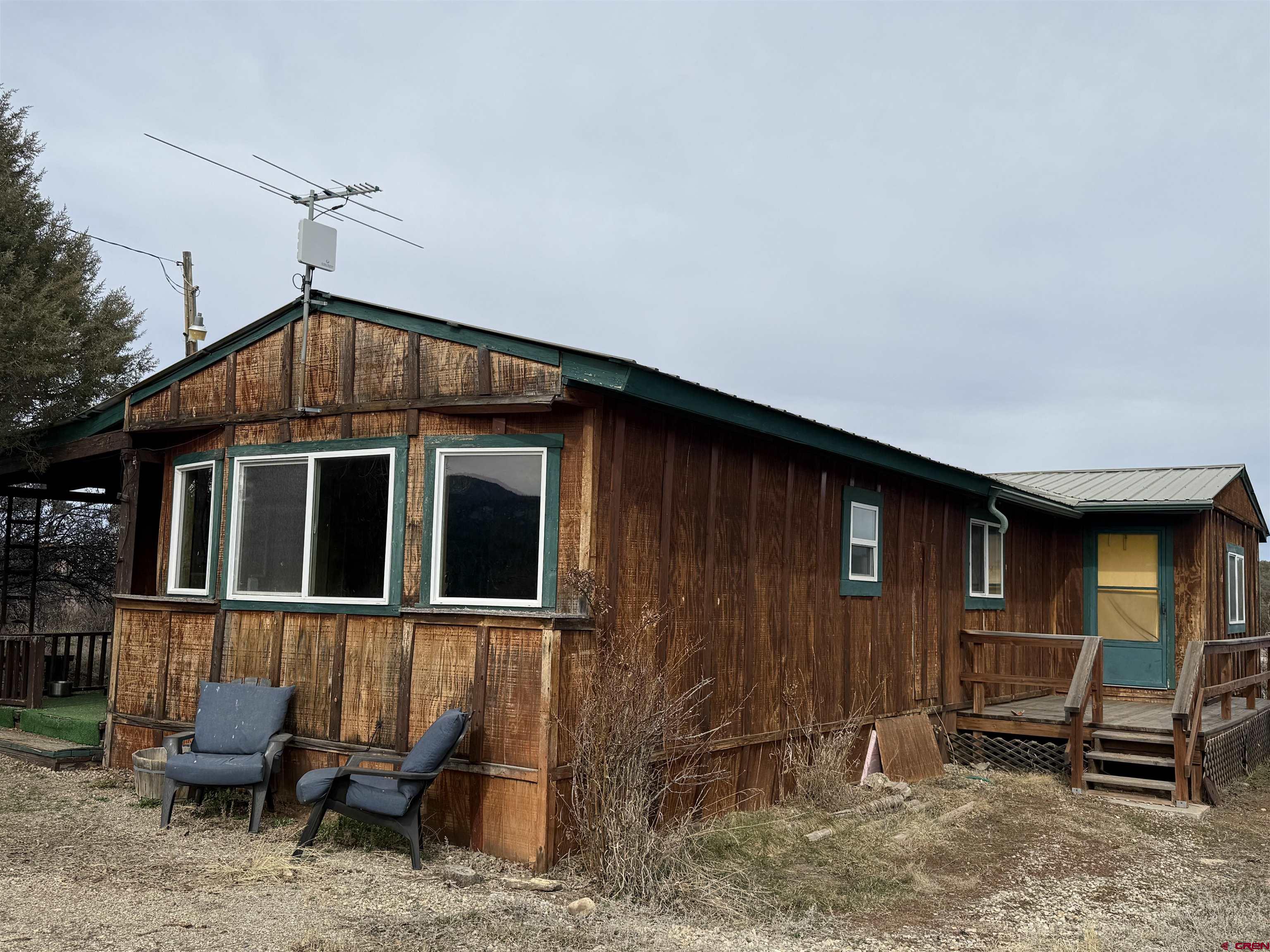 35575 Rd H.5 Mancos, CO 81328 - Photo 10 of 12 a front view of a house with many windows