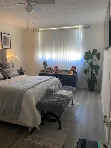 a bedroom with furniture and lamp