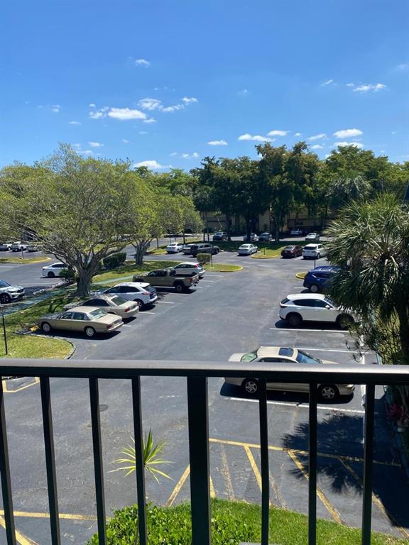 9091 Lime Bay Boulevard, Unit 304 Tamarac, FL 33321 - Photo 24 of 25 a view of swimming pool from a balcony