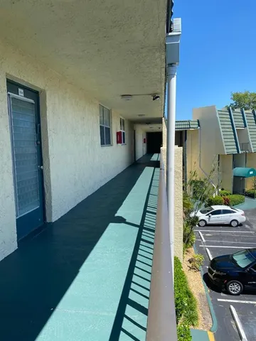 a view of yard from deck of living room