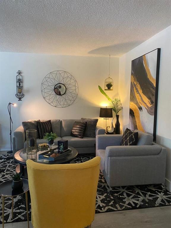 9091 Lime Bay Boulevard, Unit 304 Tamarac, FL 33321 - Photo 4 of 25 a living room with furniture and a window