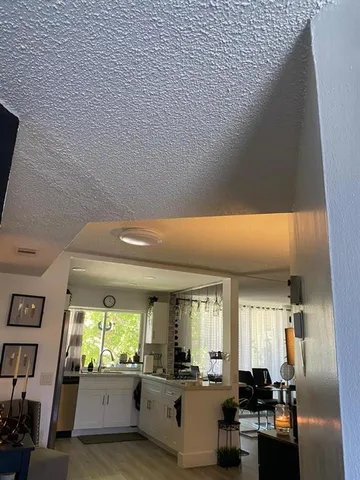 a lobby with furniture and floor to ceiling window