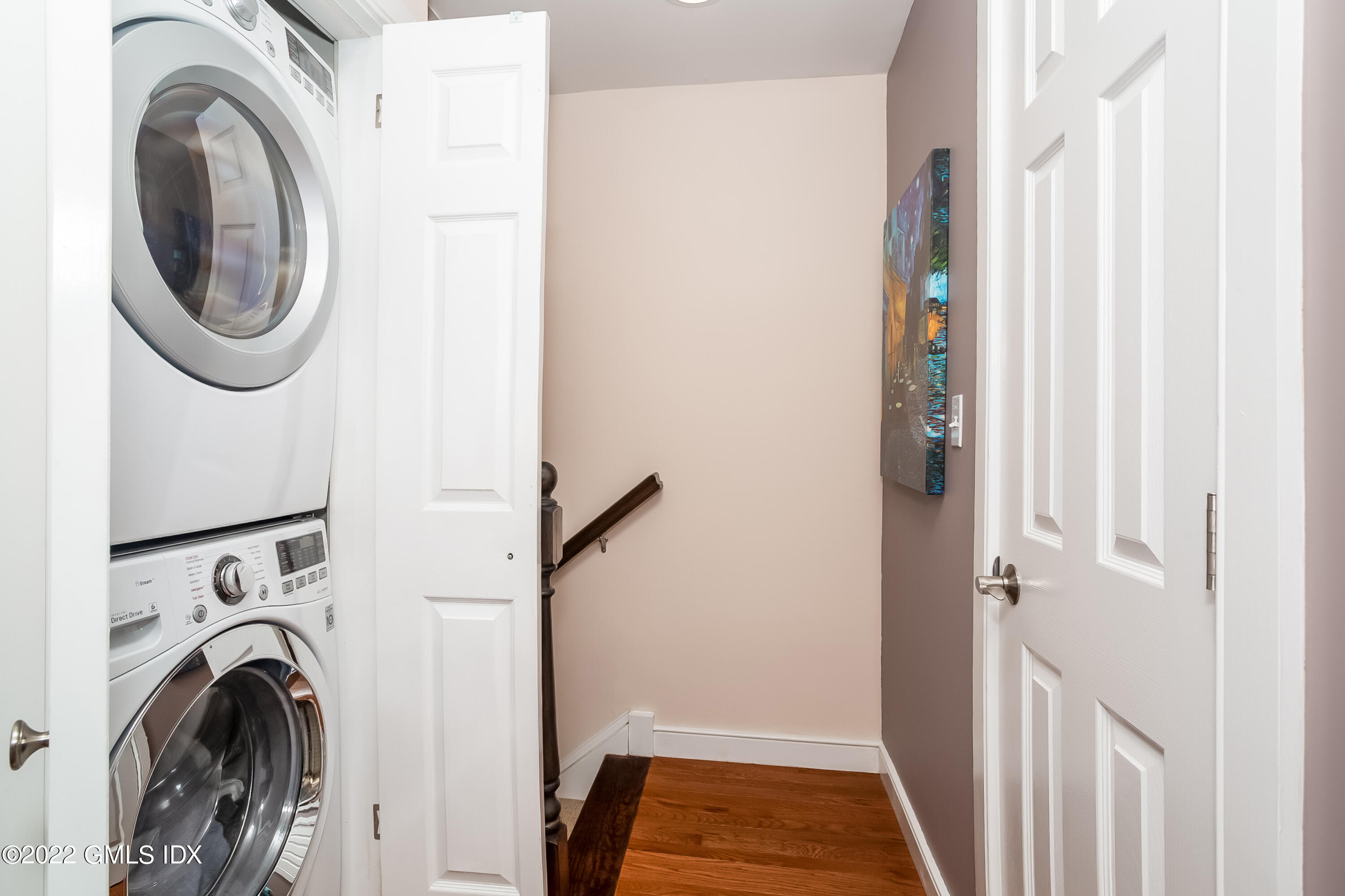 453 East Putnam Avenue, Unit 4H Cos Cob, CT 06807 - Photo 15 of 31 a view of a hallway with washer and dryer