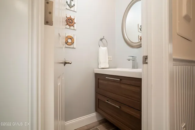 a bathroom with a sink and a mirror