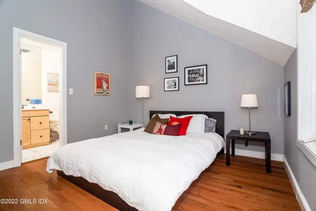 a bedroom with a bed and a view of bathroom