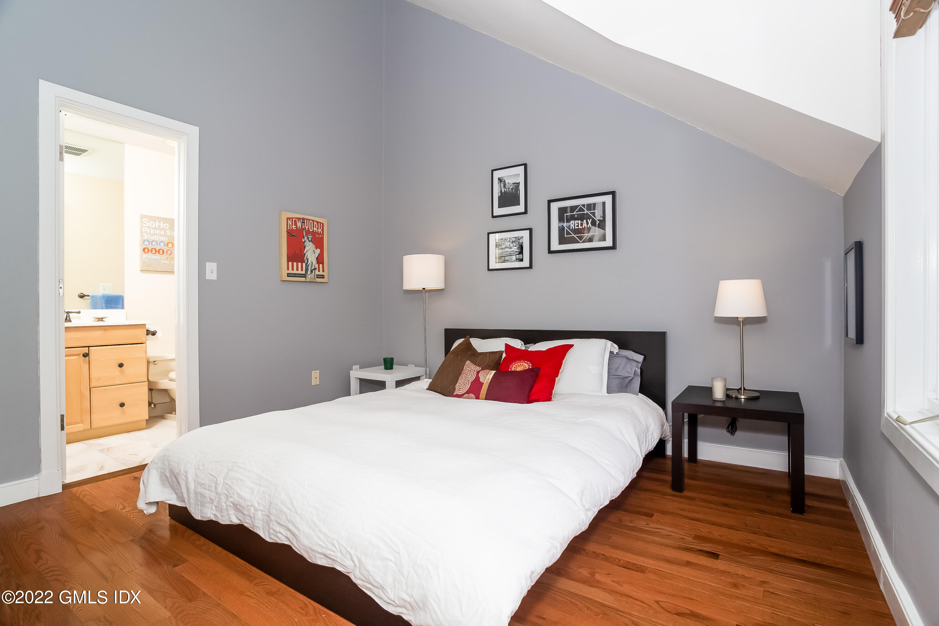 453 East Putnam Avenue, Unit 4H Cos Cob, CT 06807 - Photo 23 of 31 a bedroom with a bed and a view of bathroom