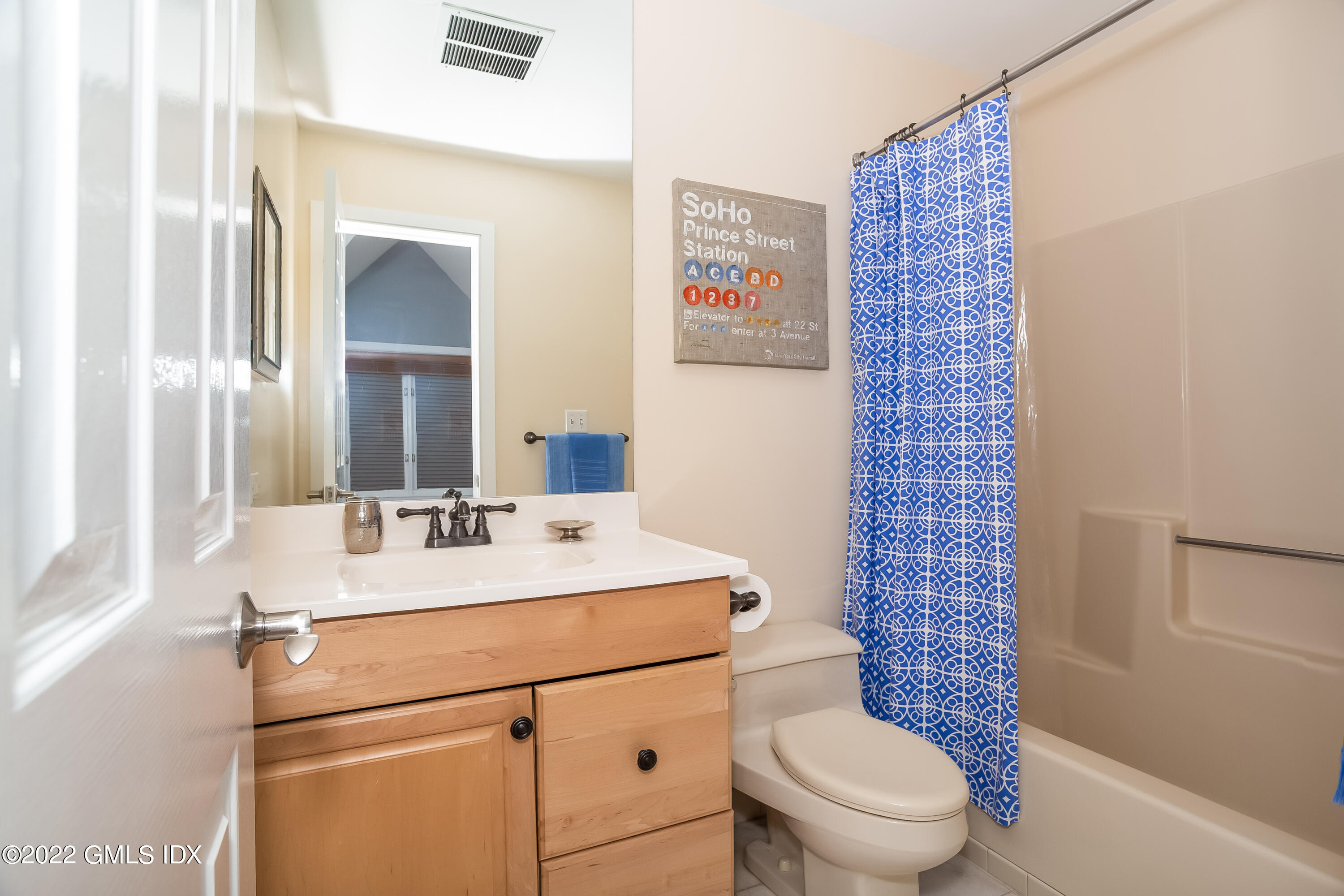 453 East Putnam Avenue, Unit 4H Cos Cob, CT 06807 - Photo 24 of 31 a bathroom with a sink a toilet a mirror and shower