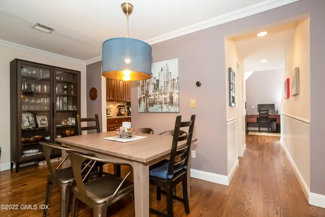 a view of a dining room with furniture and wooden floor