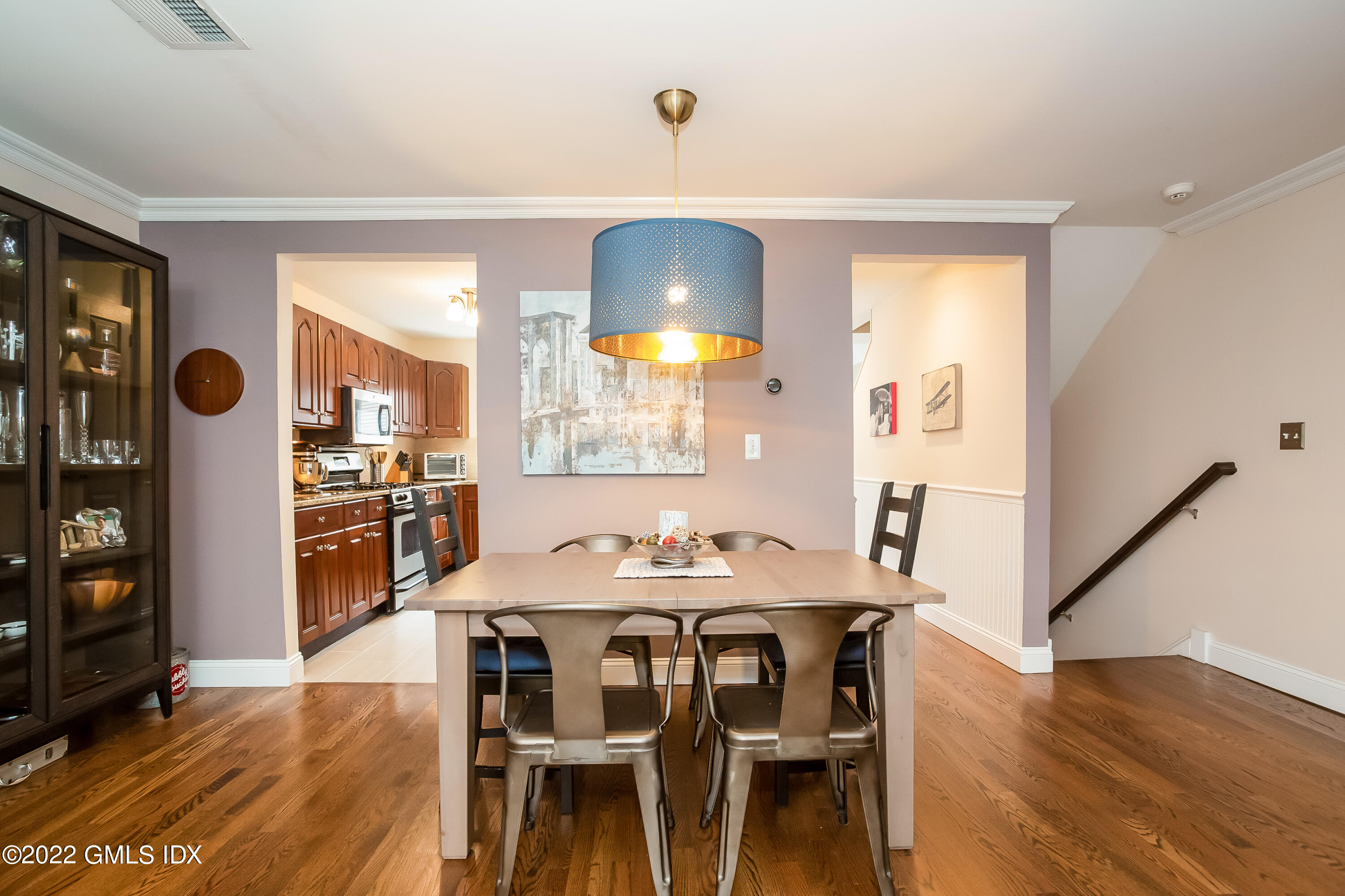 453 East Putnam Avenue, Unit 4H Cos Cob, CT 06807 - Photo 9 of 31 a view of a dining room with furniture and wooden floor