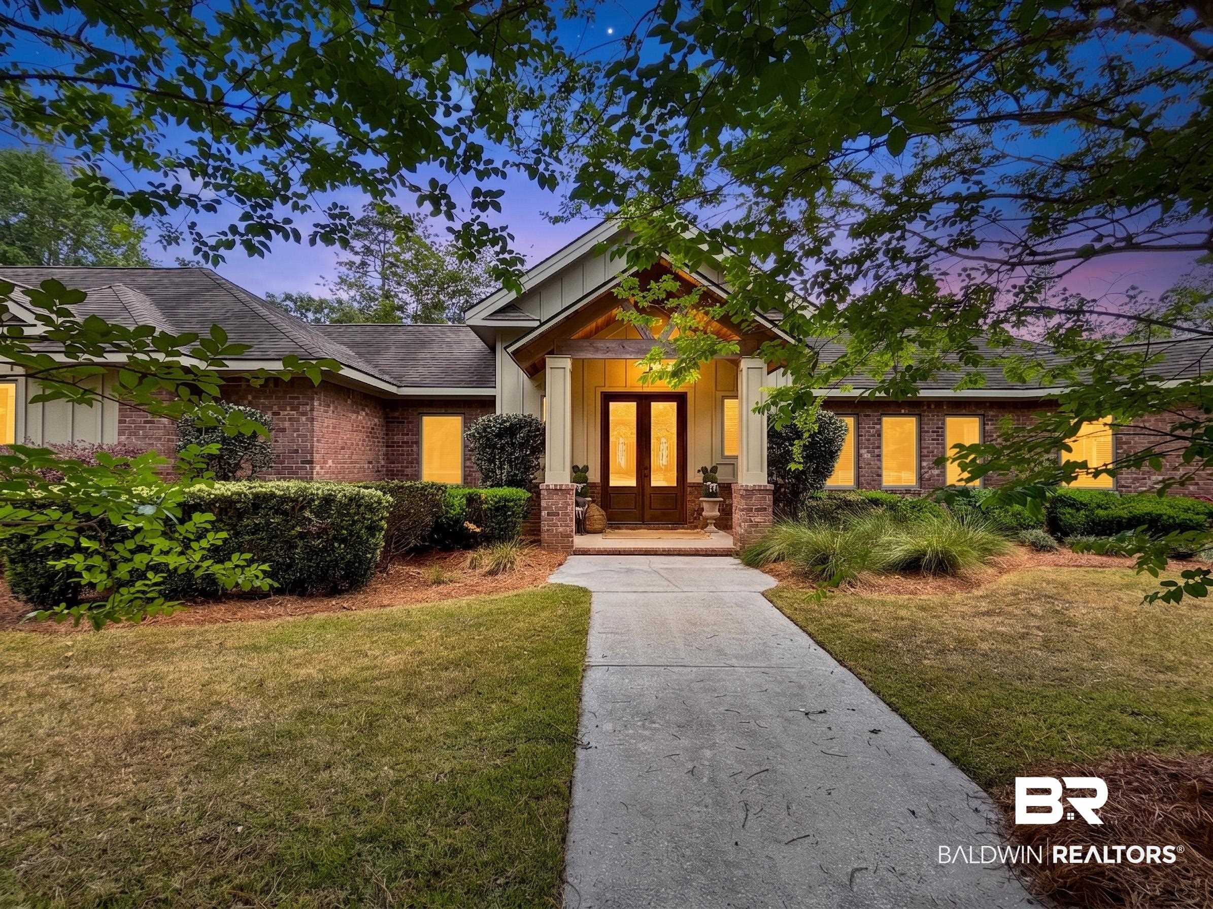 47252 Emmons Road Bay Minette, AL 36507 - Photo 3 of 50 Craftsman-style house with french doors, a front yard, board and batten siding, and brick siding