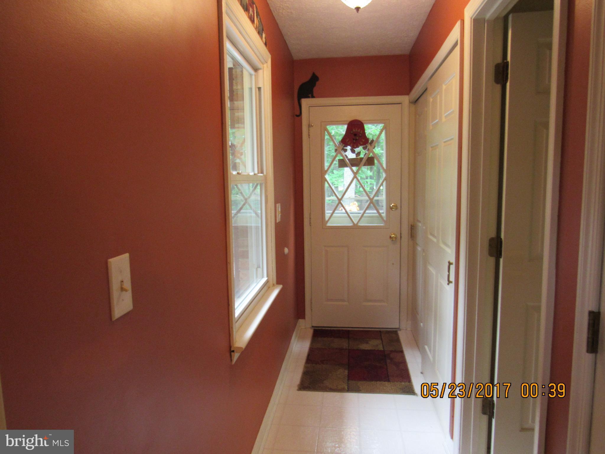 29057 Lacewood Road Rhoadesville, VA 22542 - Photo 2 of 22 hallway leading into kitchen