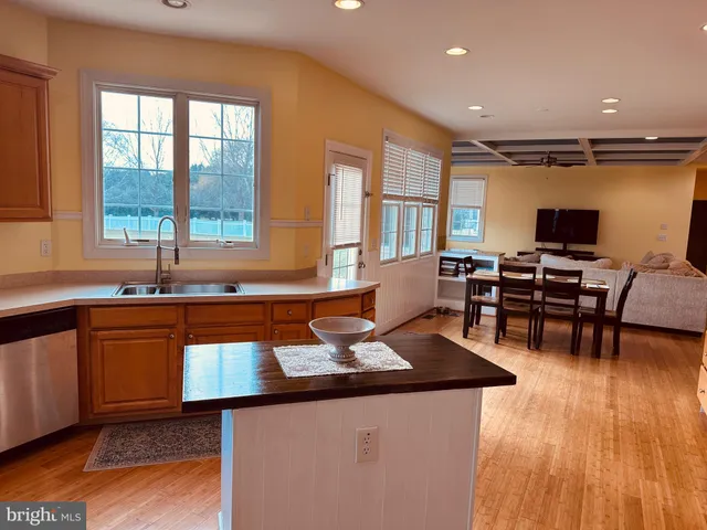 a kitchen that has a sink and a stove in it