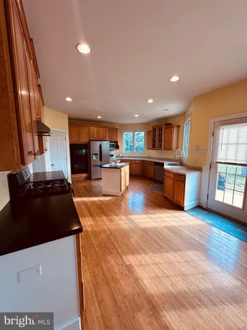 a living room with furniture flat screen tv and a fireplace