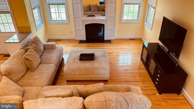 a bedroom with a bed and a ceiling fan