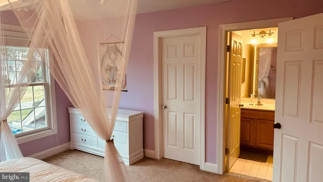 a view of a livingroom with furniture window and wooden floor