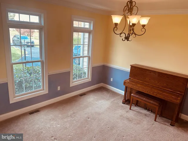 a kitchen that has a sink a stove and wooden floor