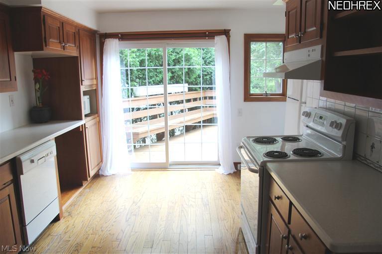 2591 Eaton Road Cleveland, OH 44118 - Photo 7 of 17 Lots of cupboard and counter space in the kitchen. Enjoy your morning coffee or family dinner on the roomy deck.
