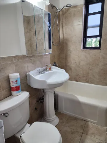 a bathroom with a sink toilet and a bathtub