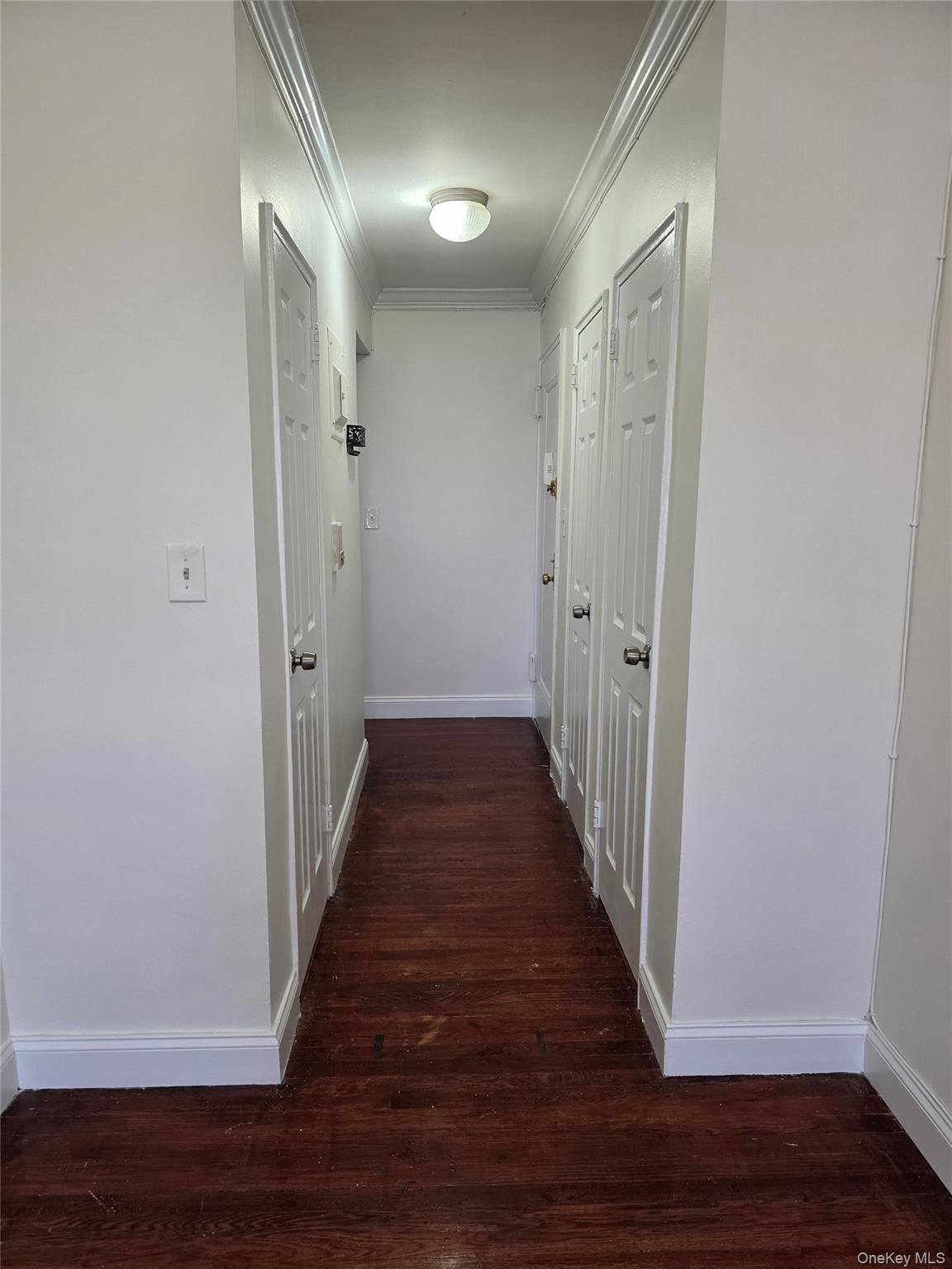 150-11 72nd Road Queens, NY 11367 - Photo 5 of 8 a view of a hallway with wooden floor
