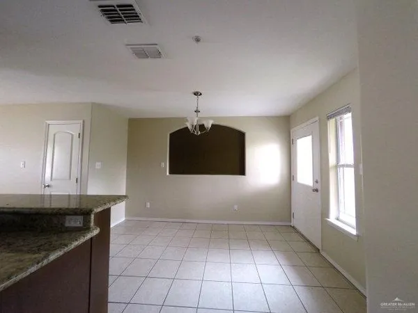 a kitchen with a sink a stove and cabinets