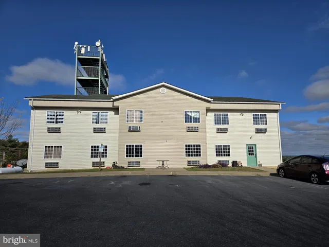 a view of a house with a street