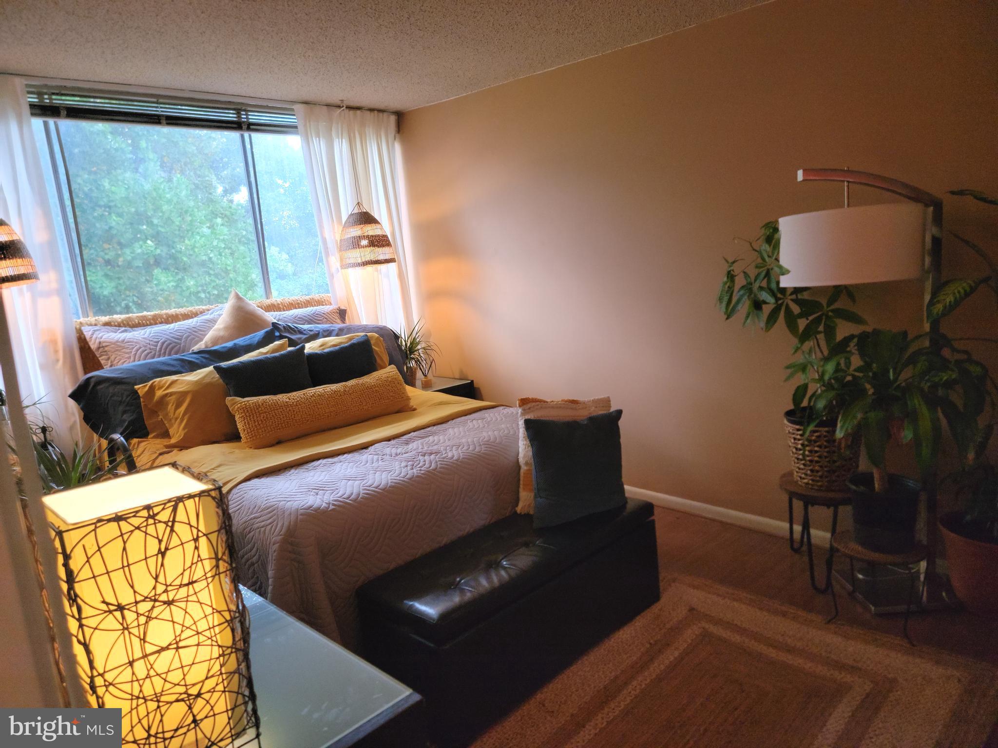 1822 Metzerott Road, Unit 105 Adelphi, MD 20783 - Photo 8 of 14 a bedroom with furniture and a window