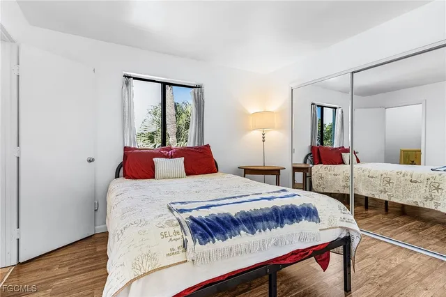 a bedroom with a bed and window