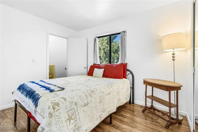 a bedroom with bed and a window