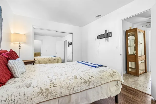 a bedroom with a bed and a lamp