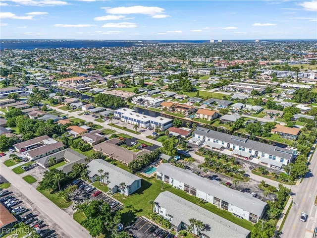 an aerial view of city and lake