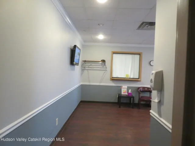 a room with furniture and a wooden floor