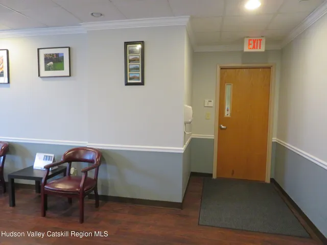 a view of a livingroom with furniture and windows