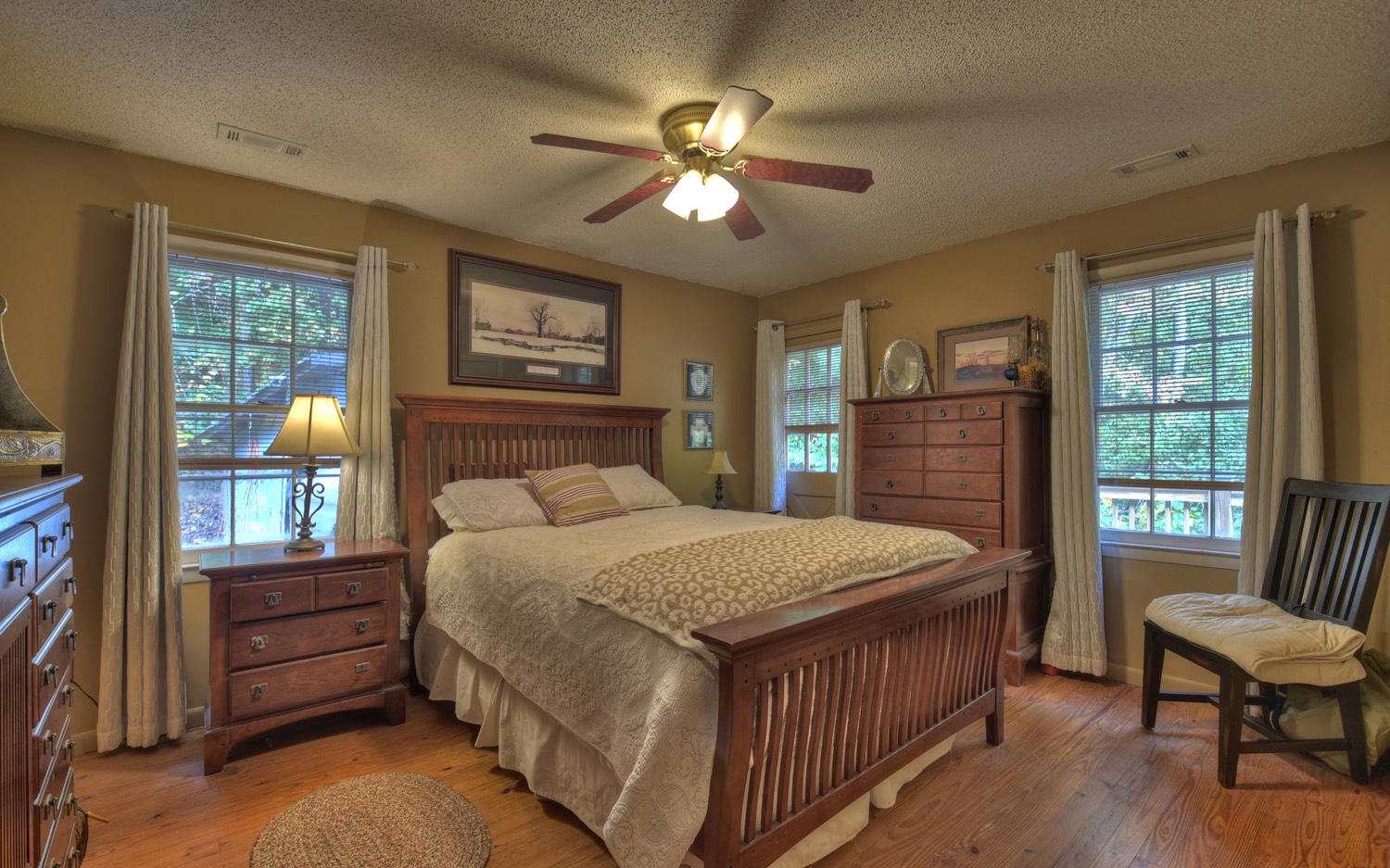 63 Chimney Court Ellijay, GA 30540 - Photo 19 of 49 a bedroom with a bed and a chandelier