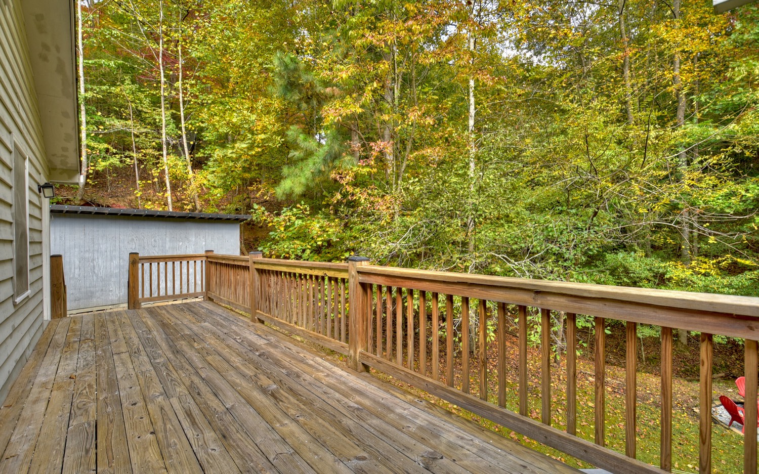 63 Chimney Court Ellijay, GA 30540 - Photo 28 of 49 a balcony with wooden floor and fence