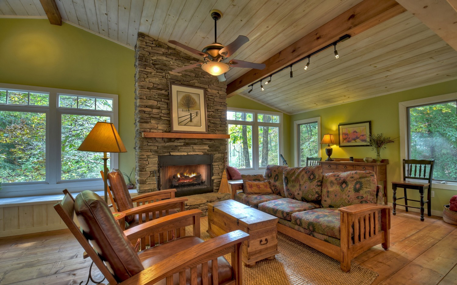 63 Chimney Court Ellijay, GA 30540 - Photo 9 of 49 a living room with furniture a fireplace and a chandelier