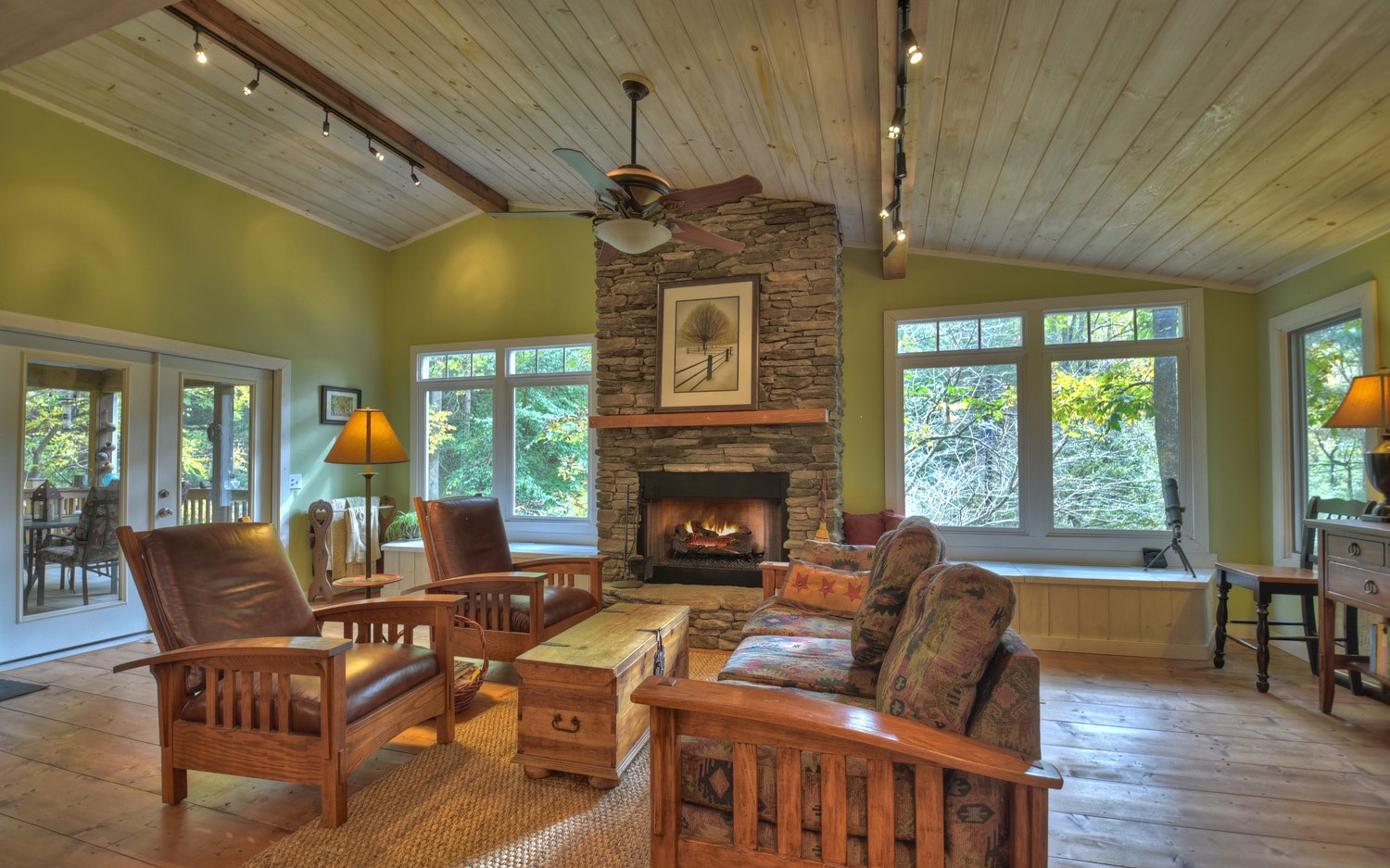 63 Chimney Court Ellijay, GA 30540 - Photo 10 of 49 a living room with furniture a fireplace and large windows