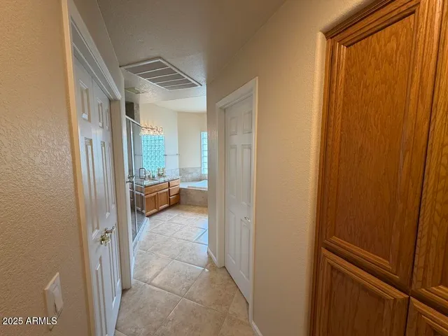 a spacious bathroom with sink and bathtub