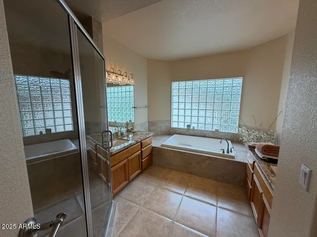 a bathroom with a shower and a mirror
