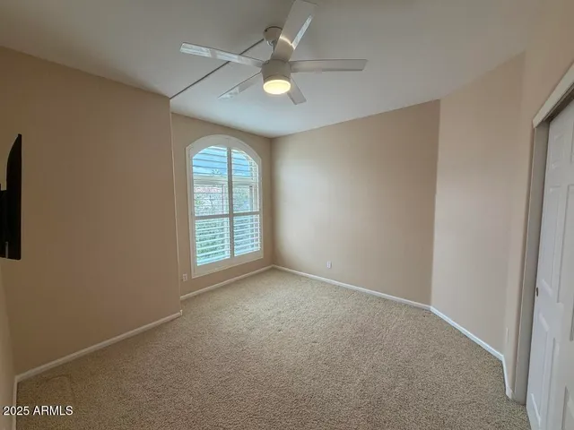 a view of an empty room with a flat screen tv