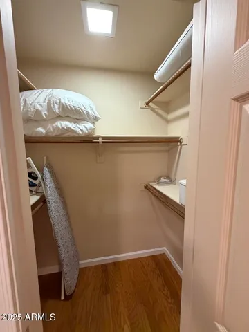 a bathroom with a granite countertop sink a toilet and a mirror