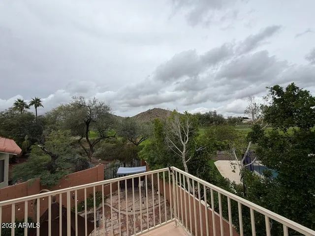 a kitchen with stainless steel appliances granite countertop a stove top oven a sink and a refrigerator