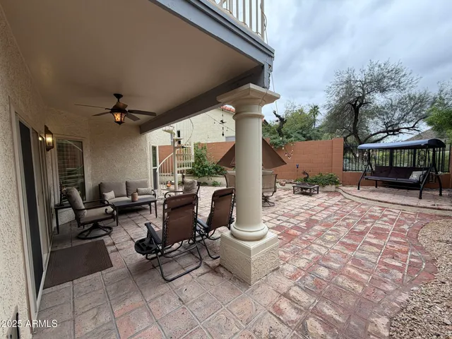 a living room with furniture and a chair