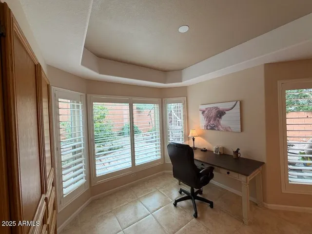 a view of a livingroom with furniture and a kitchen