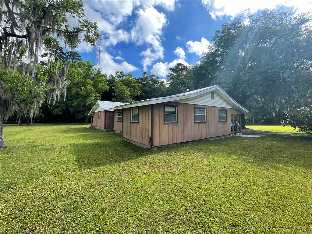 45013 Bismark Road Callahan, FL 32011 - Photo 14 of 26 a view of a house with backyard